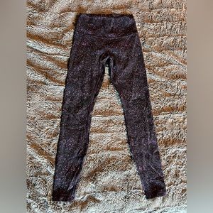Lululemon luxtreme legging. Black with purple splatter look. Size 6. Inseam 27.